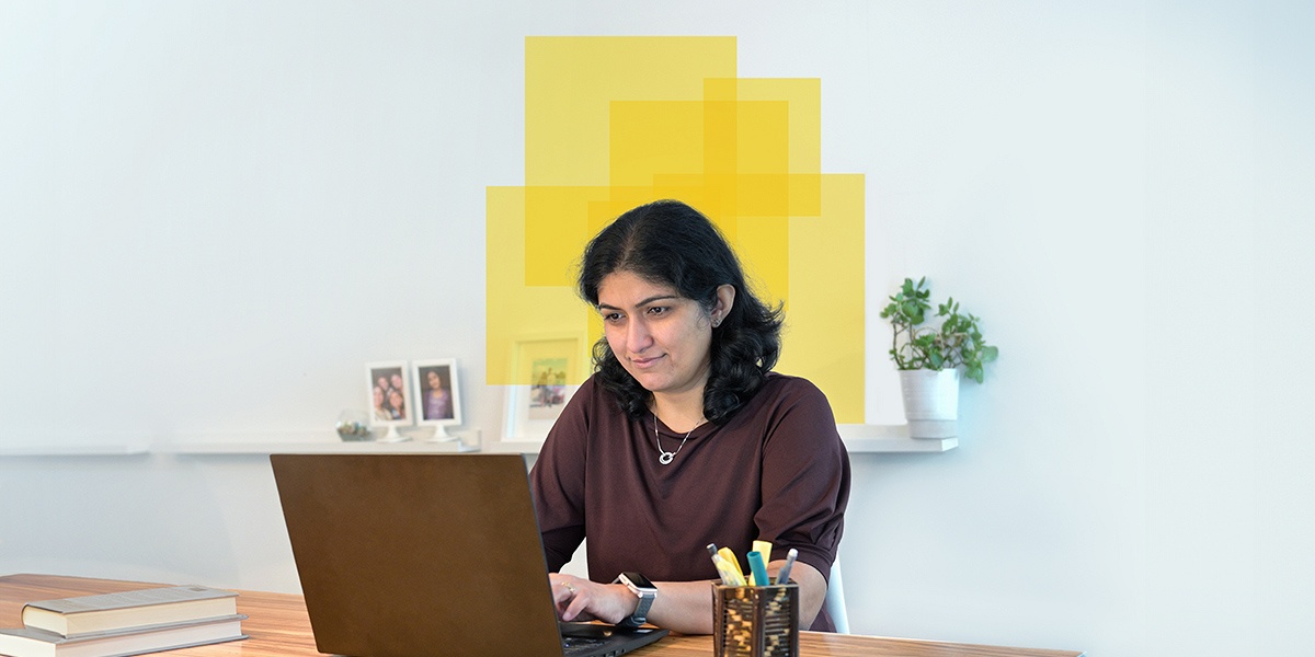 data science student Vidhu working on laptop.