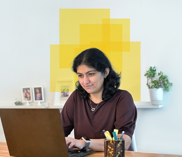 data science student Vidhu working on laptop.